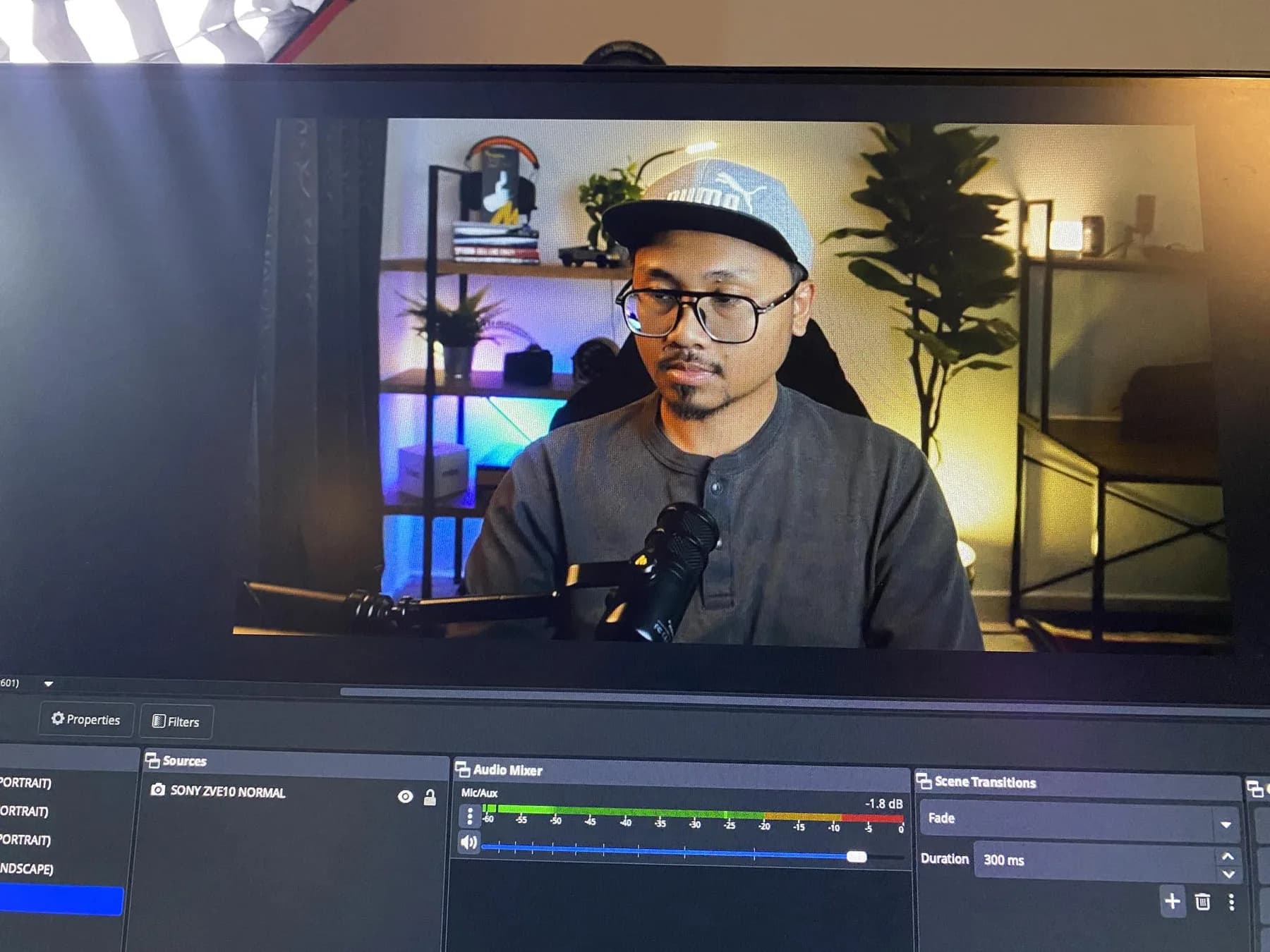 The OBS window mid-recording, showing me on camera through the Sony, with the audio mixer and the scene transitions along the bottom of the screen.